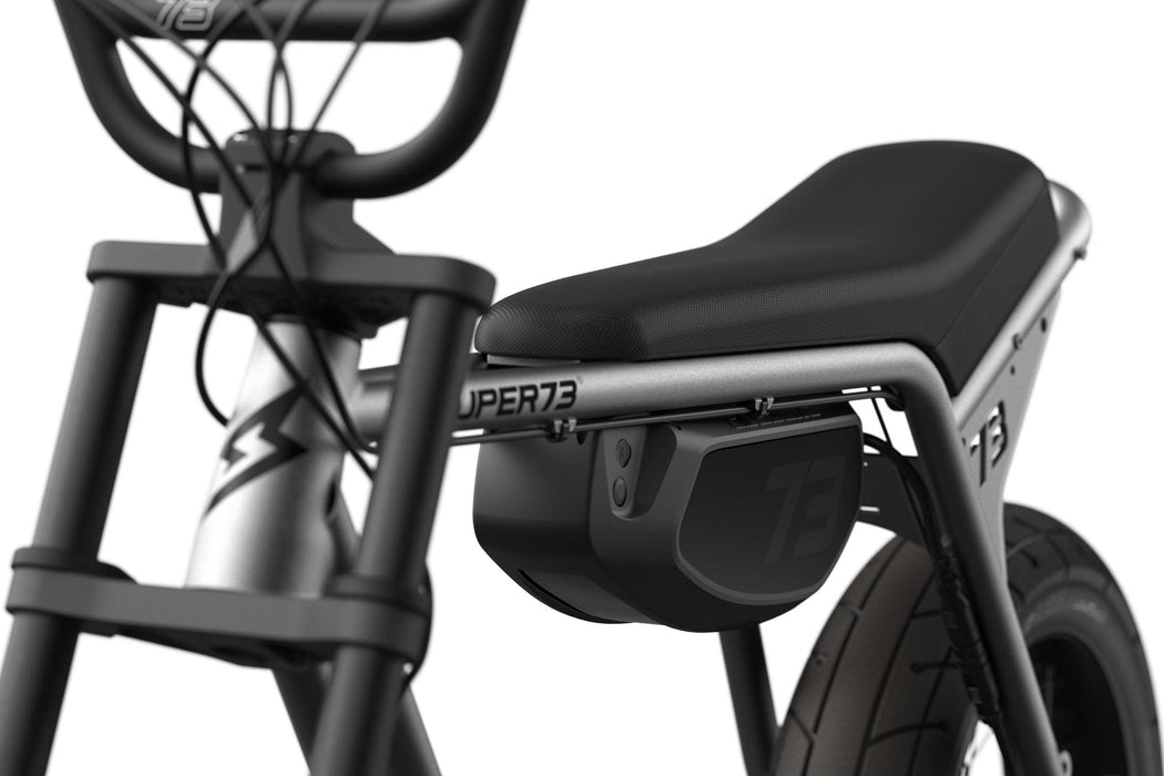 Studio image showing the removable battery and seat on the SUPER73-ZX in Metallic Aluminum. @color_metallic aluminum