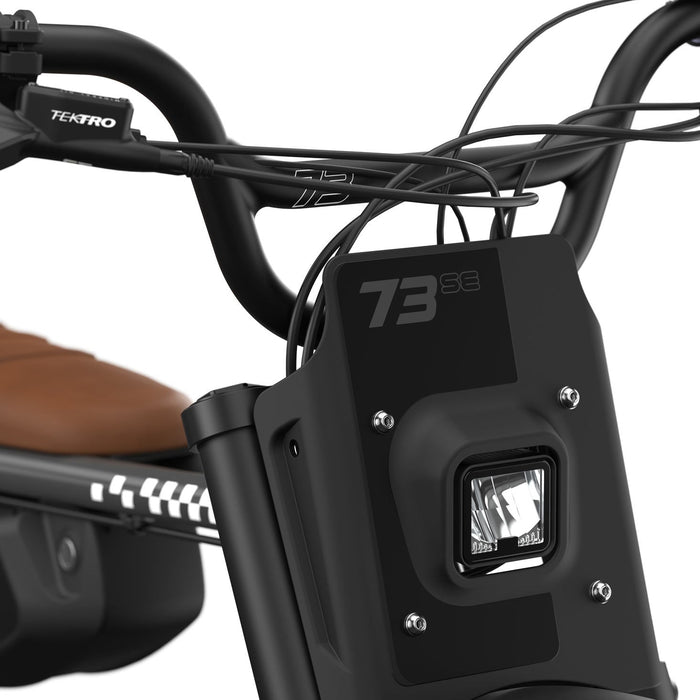 Detail image of the handlebars and headlight on the SUPER73-Z Adventure SE ebike in Palladium. @color_palladium