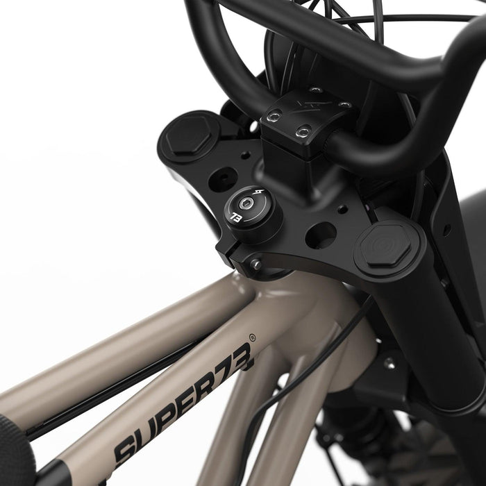 Detail image of the rear GRZLY tire on the SUPER73-Z Adventure Core ebike in Sandstorm. @color_sandstorm