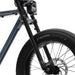 Detail image showing the front fork and TROOPER tires on the SUPER73-ZX ebike in Panthro Blue. @color_panthro blue