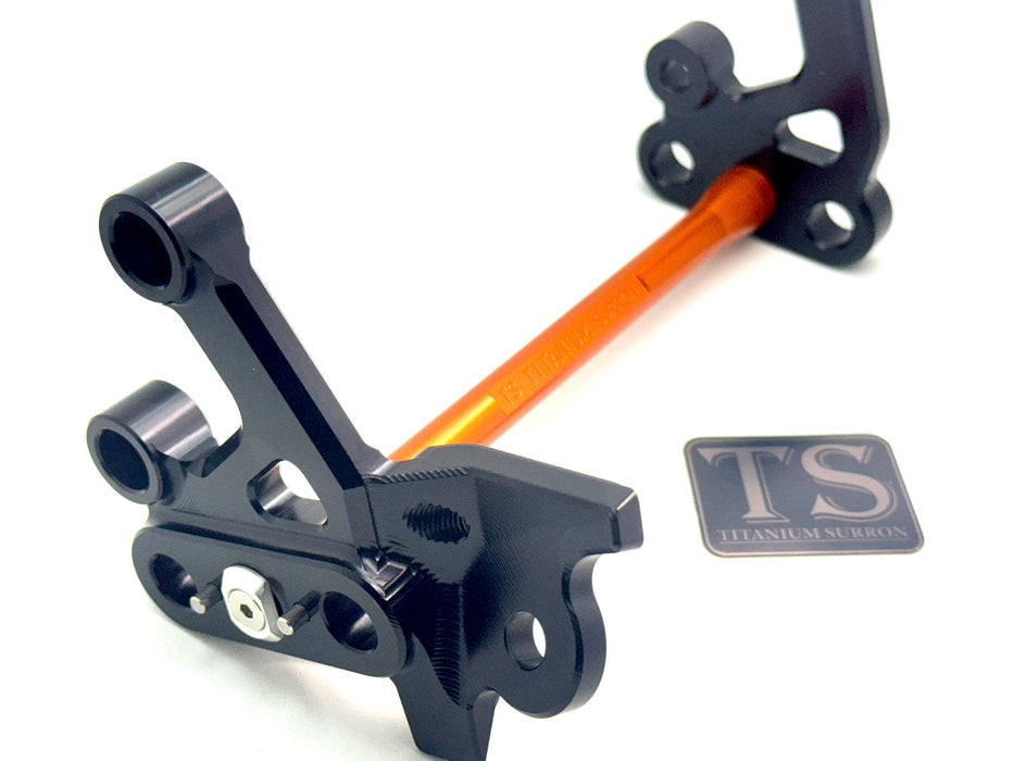 Titanium Surron Custom CNC Aluminum Footpeg Bracket Assembly Surron Burnt Orange / Black Footpeg bracket assembly LBX