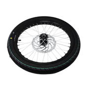 Motorcycle wheel with black tire and silver rim on a white background