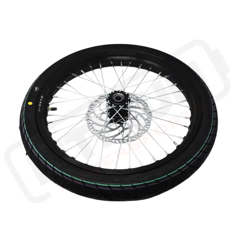 Motorcycle wheel with black tire and silver rim on a white background