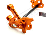 TS Custom CNC Aluminum Footpeg Bracket Assembly Surron - Burnt Orange / Black - Footpeg bracket assembly LBX